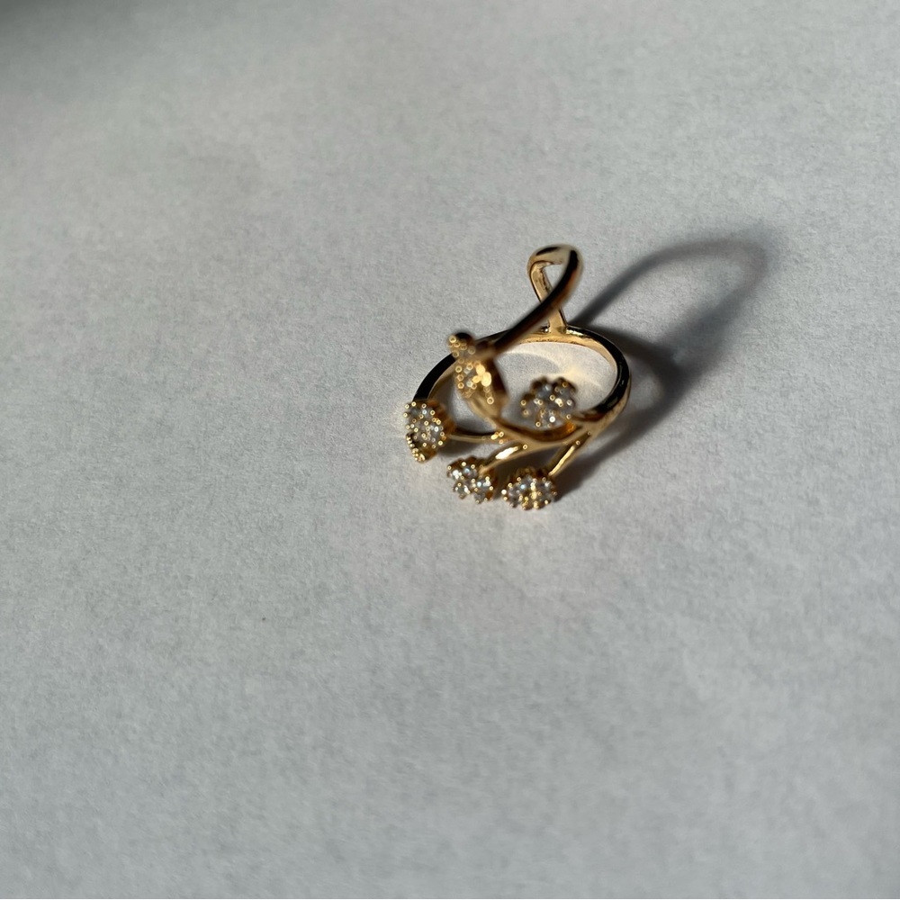 Floral design ring adjustable yellow gold color.